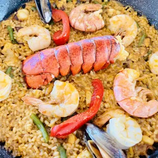 a pan of seafood and rice