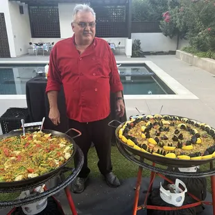 Chef Daniel with his two finished paella pans - so pretty we didn't want to eat it!!