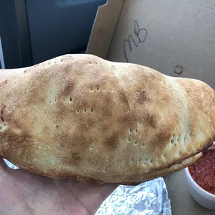 Huge meatball cheese calzone