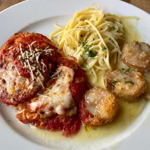Jay&apos;s Plate: three shrimp Paesano, eggplant Parmesan, and spaghetti with garlic butter