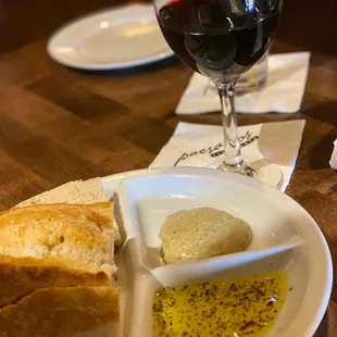 a plate of bread and a glass of wine