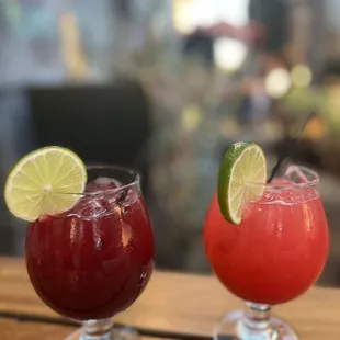 two cocktails on a wooden table