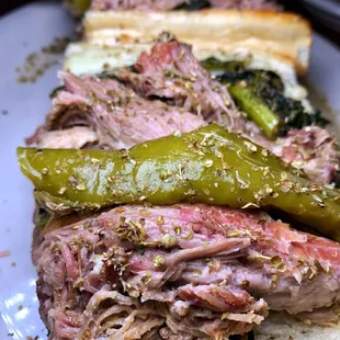 a roast beef sandwich with pickles