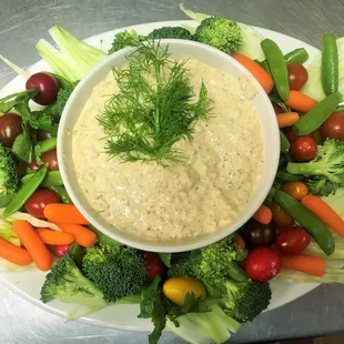 Roasted red pepper and arugula dip with assorted fresh vegetables.