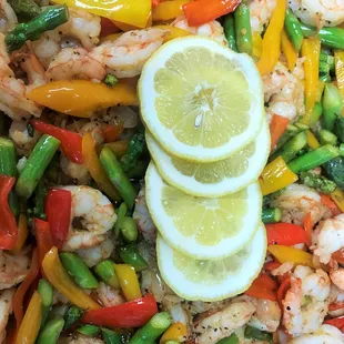 Grilled shrimp with fresh, seasonal vegetables.