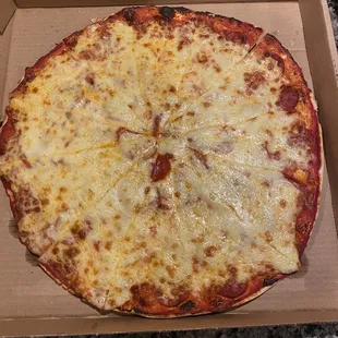 Large pepperoni. Note the pepperoni's are under the cheese.