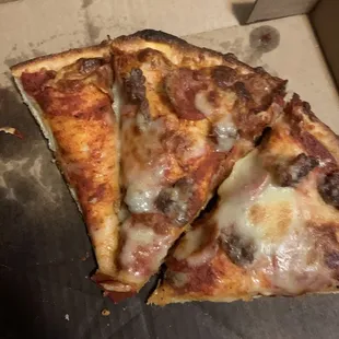 Pan crust, pepperoni and sausage pizza.