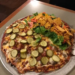 Half and half, taco and bacon cheeseburger. Taco comes with taco sauce and sour cream.