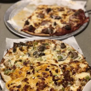 Closest pizza is 1/2 Chicken Santa Fe &amp; 1/2 Philly Cheesesteak (chicken was better than steak$ &amp; further pizza is the "meat lovers".