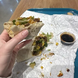 Wrap with brown rice, sriracha steak, and magnolia sauce on the side.