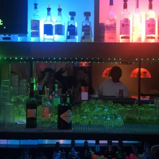 a bar with a lot of liquor bottles