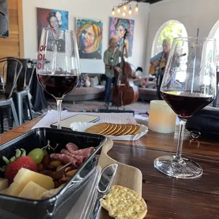 a glass of wine and a plate of food