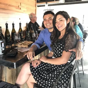 two people sitting at a bar