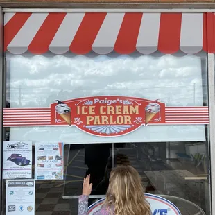 a little girl waving