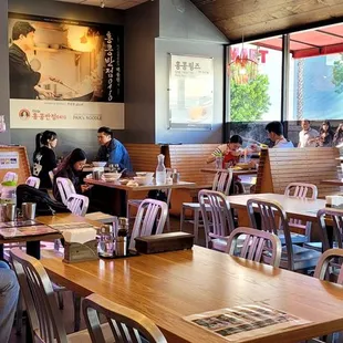  people sitting at tables in a restaurant