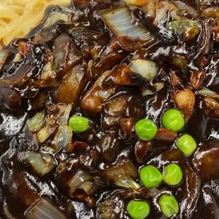 a plate of noodles and mushrooms