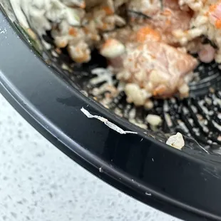 Hard metal piece in the salmon poke.