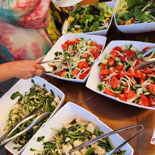 a table full of salads