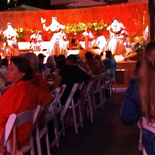 a group of people sitting at tables