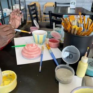 a man painting a cake