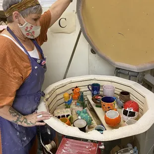 Pottery is stacked in layers for the kiln