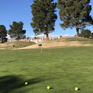 Beautiful practice green with great mountain views next to the clubhouse!