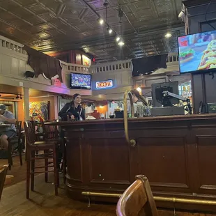 people sitting at a bar in a restaurant