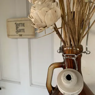 a vase with dried flowers