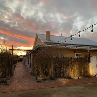 a house with a fence and lights