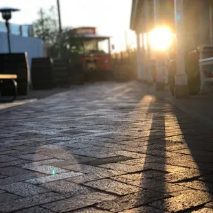 the sun setting on the street
