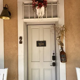 Entry to the "Lizzie" room, Jesse (owner) personalized the growler with the person staying name
