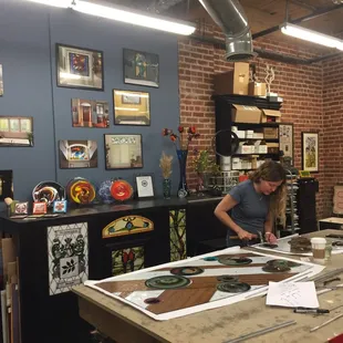 Owner, Valerie Spellman Batt working on a new stained glass piece