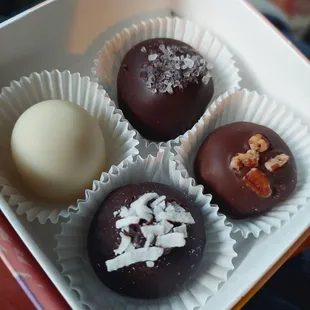 TOP: a white chocolate that had pistachio, and I think jasmine, Sea Salt BOTTOM:  Coconut Truffle,  Martha Washington