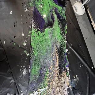 This is Noah's painting. He chose black, purple, green, gold and white!