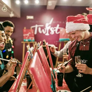 Painting and drinking is a fun office holiday party idea, too!