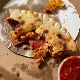 Partially devoured calzone.