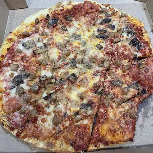 Double pepperoni, sausage and mushroom pizza.