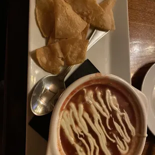 Gazpacho, delightfully chunky. Not just cold salsa and very good chips