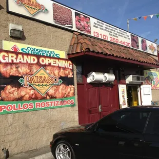 a car parked in front of a restaurant