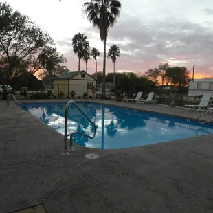 In ground pool with Fire pit area and seating