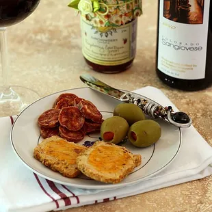 a plate of food and a glass of wine