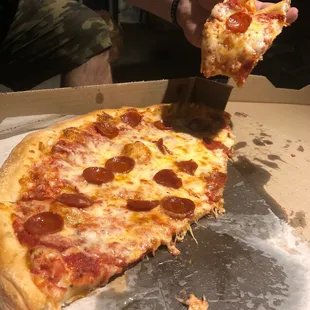 a slice of pepperoni pizza