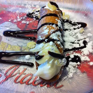 a desert with bananas and chocolate sauce