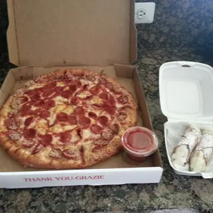 Large pepperoni pizza and two canolis for takeout