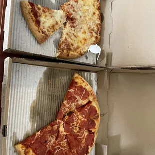 Cheese and a pepperoni medium pizzas.