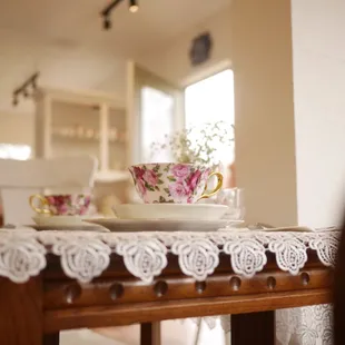 a tea cup and saucer on a table