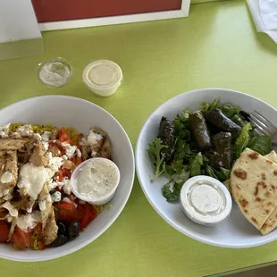 Rice bowl with chicken breast and rolled grape leaves that come with taziki sauce and a few soft pitas.  WONDERFUL!!