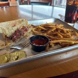 What remains of the huge Reuben sandwich!