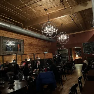 people sitting at tables in a restaurant
