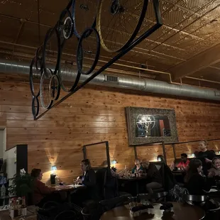 people sitting at tables in a restaurant